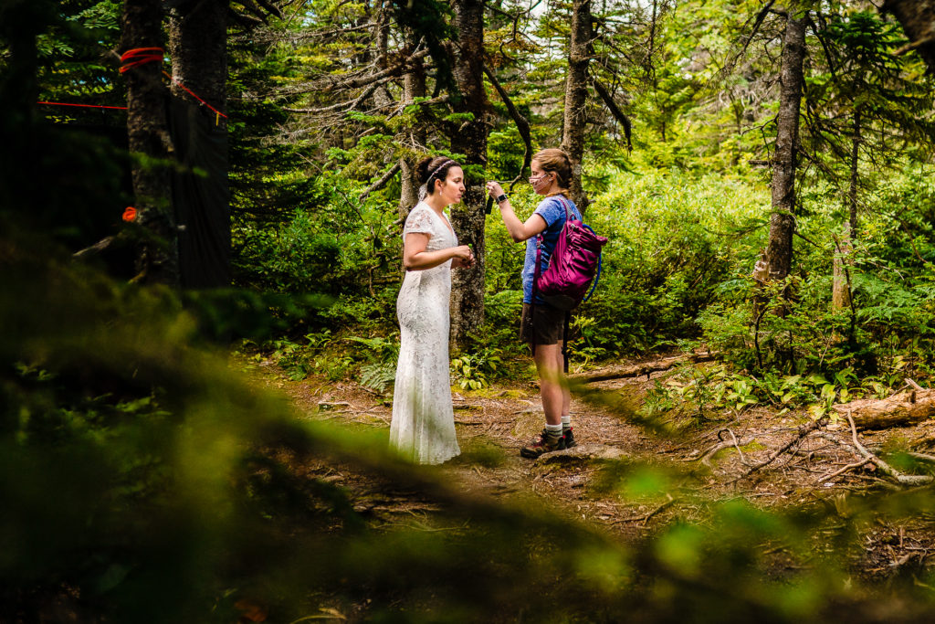 bride getting ready in the woods by Vermont Wedding Photographer Andy Madea