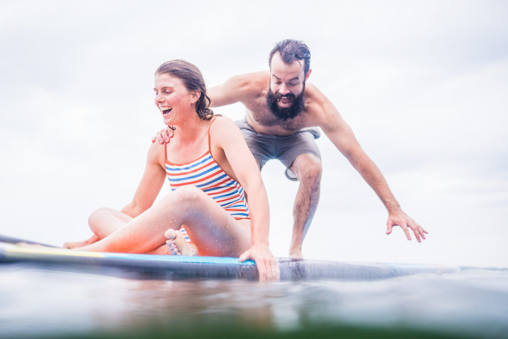 adventure engagement session, couple on paddleboard by andy madea