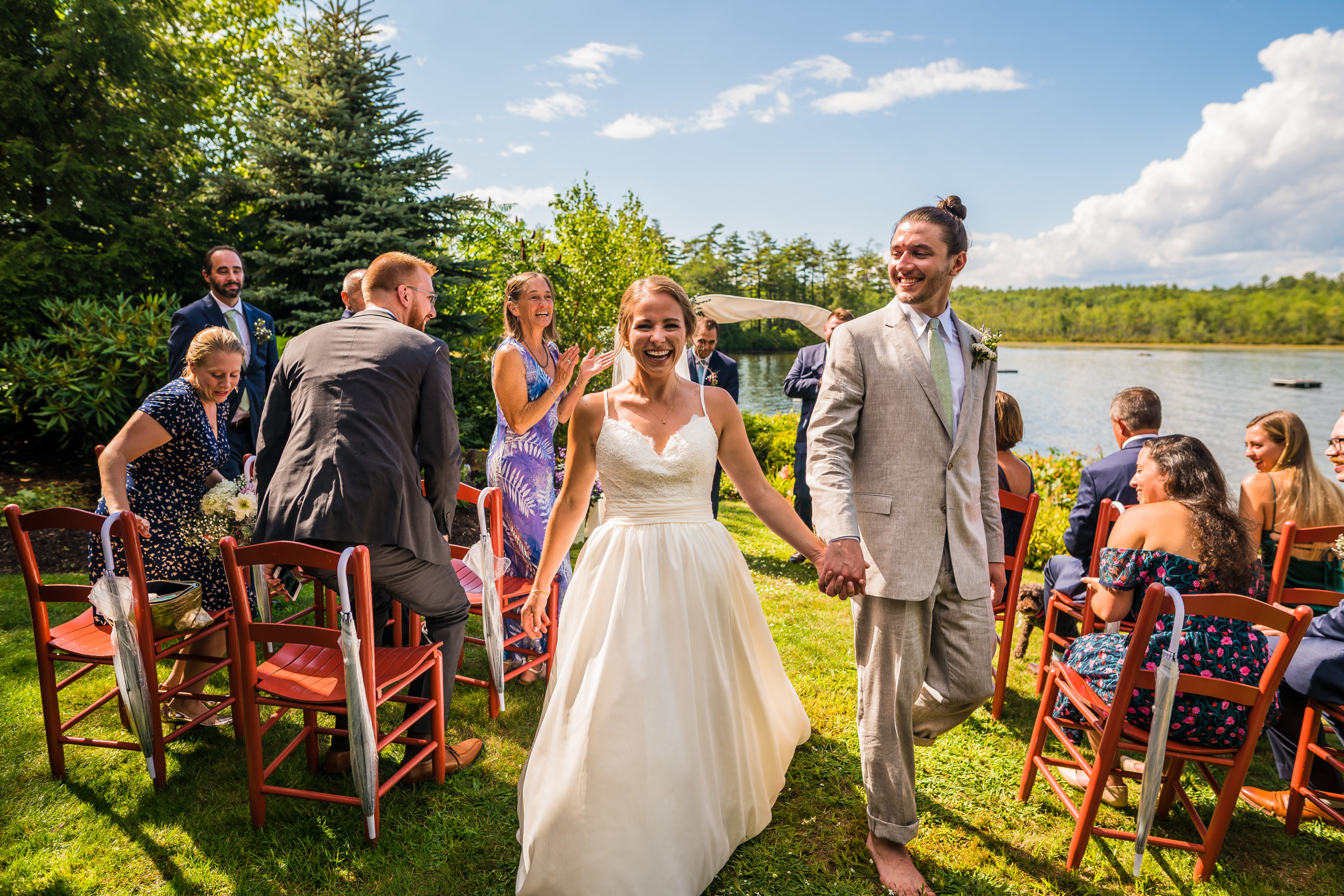 bride and groom celebrating at intimate wedding ceremony by vermont wedding photographer andy madea