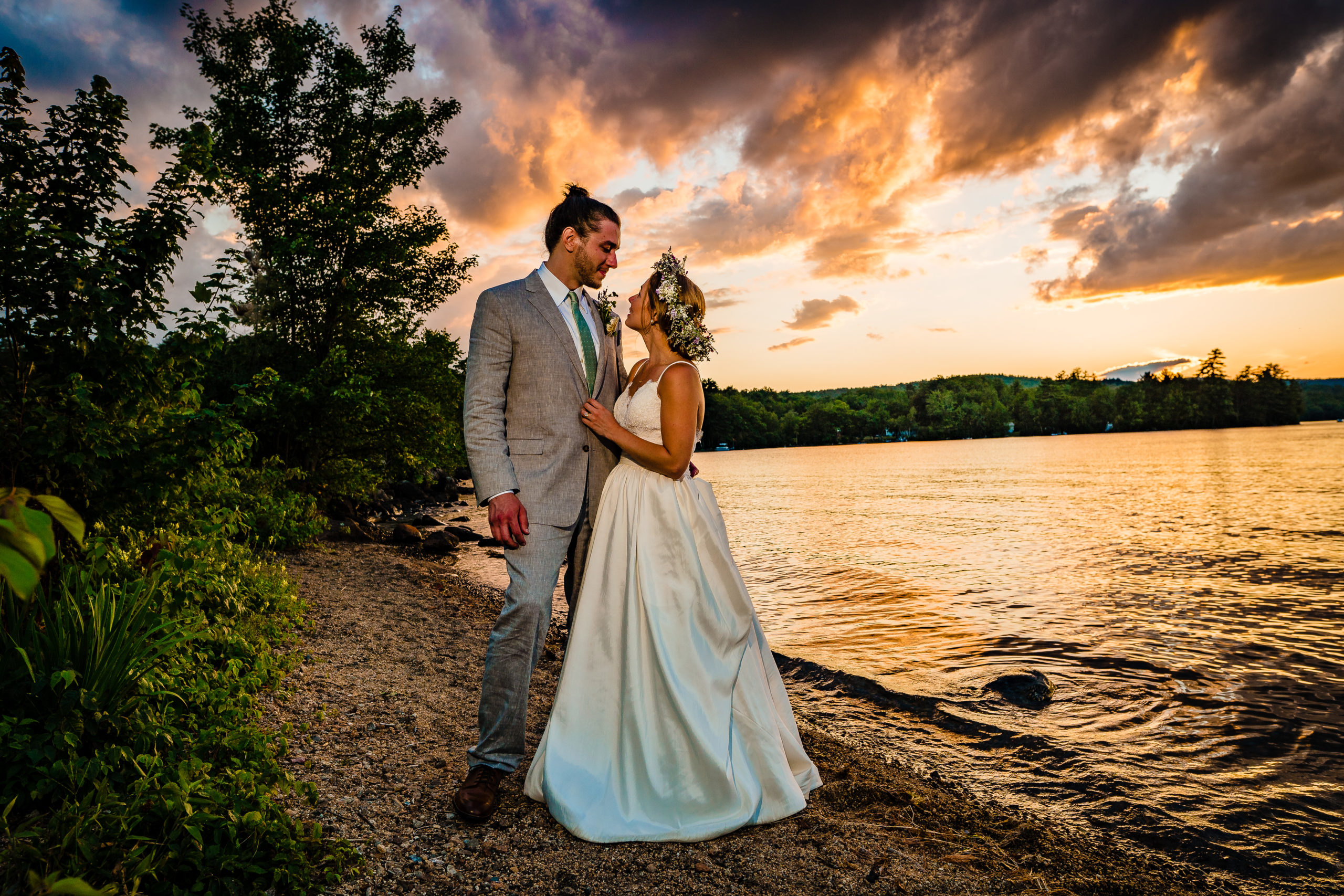 Bride and goom sunset portrait on lake Winnipesaukee