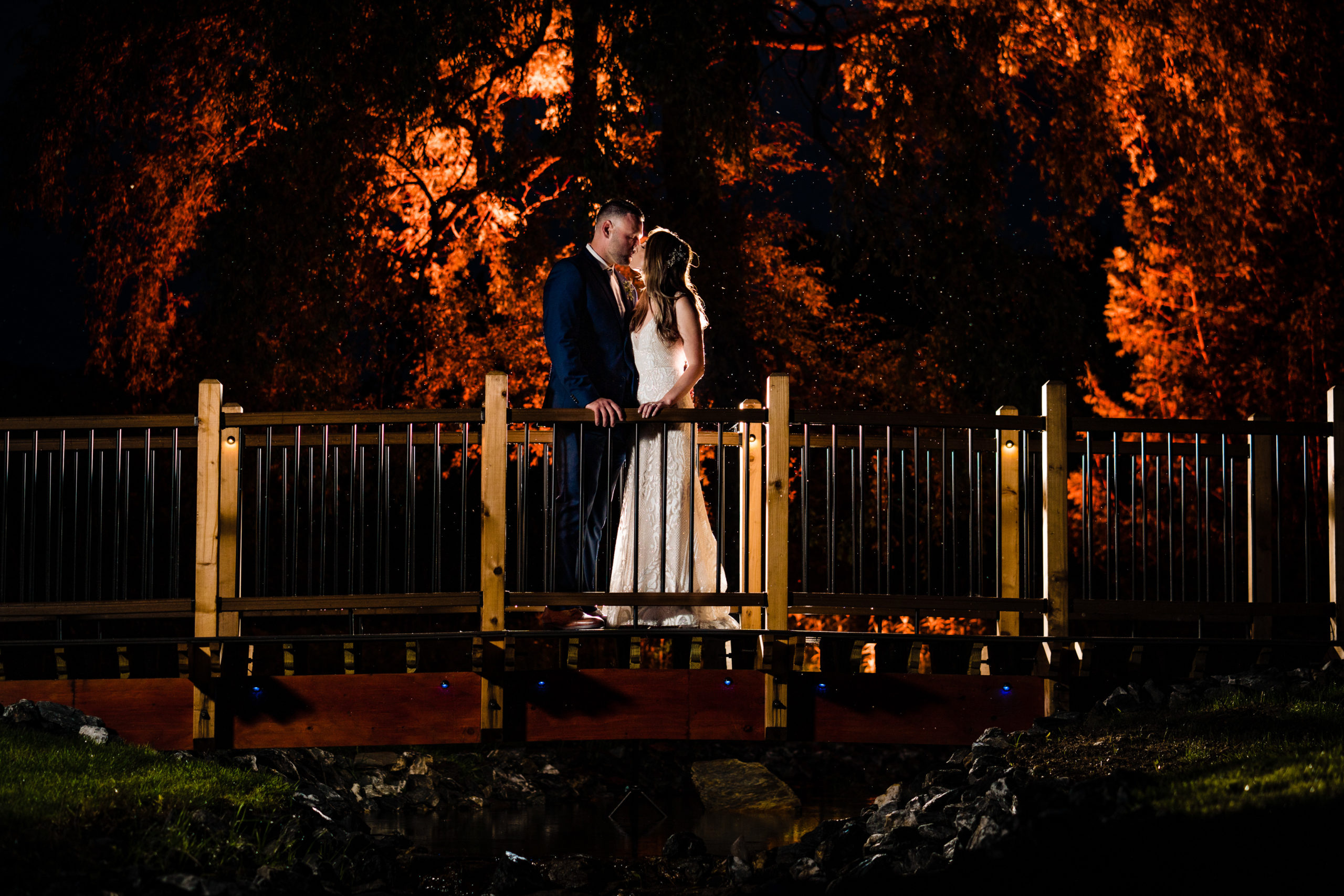 Bride and Groom portrait on bridge at topnotch resort in stowe vermont