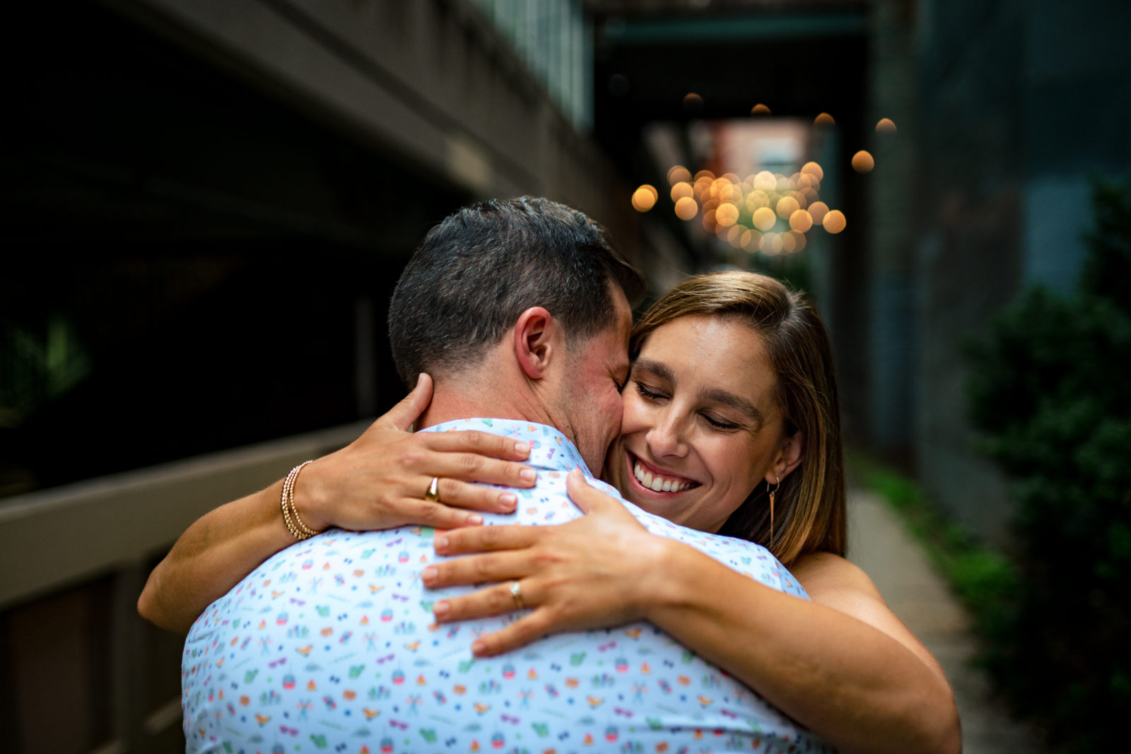 couple hugging during their burlington, vermont engagement photo shoot, by andy madea