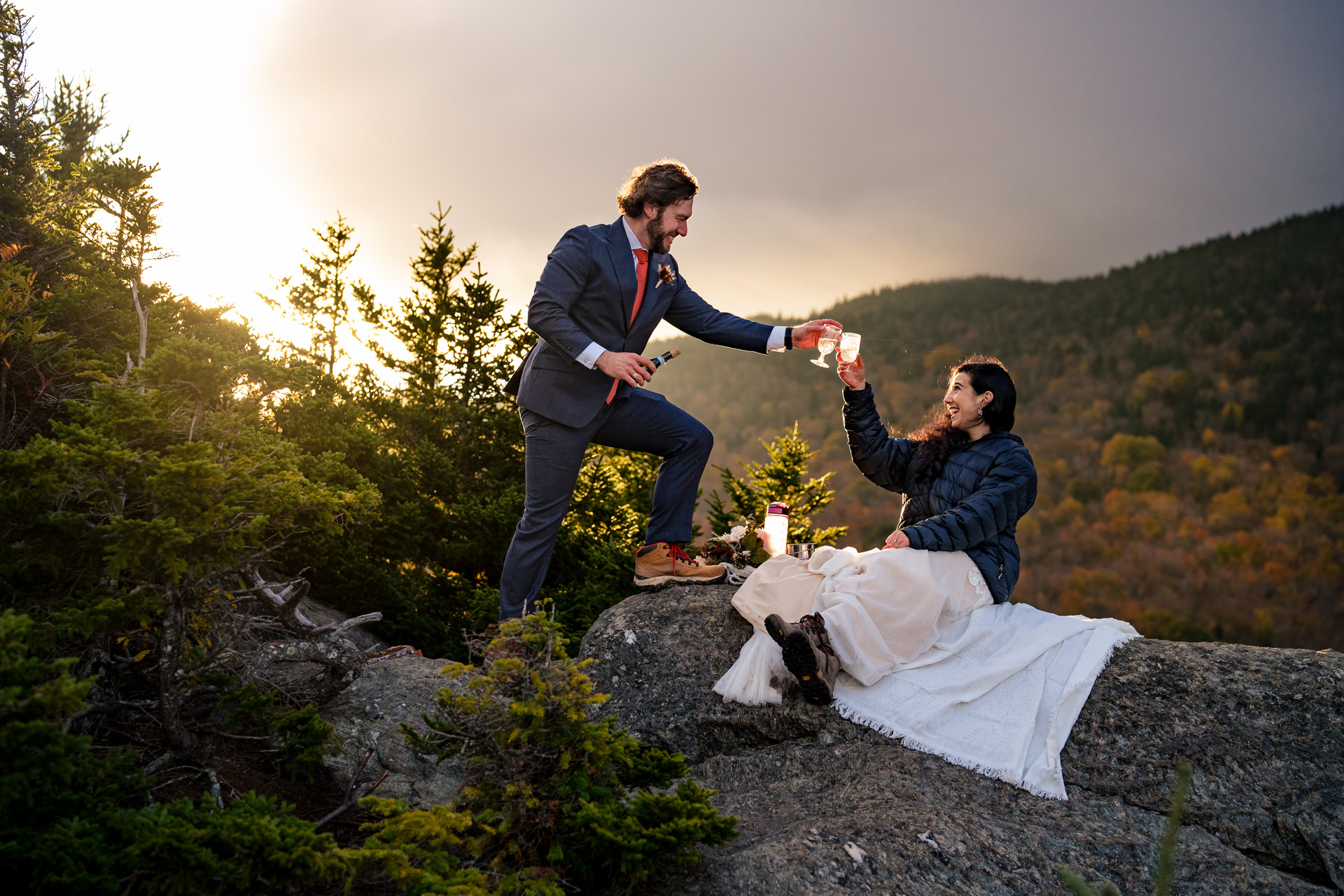 couple on a mountain for a sunrise elopement